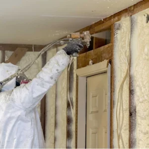 spraying foam insulation in the attic 