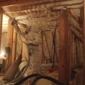 spraying insulation in the basement